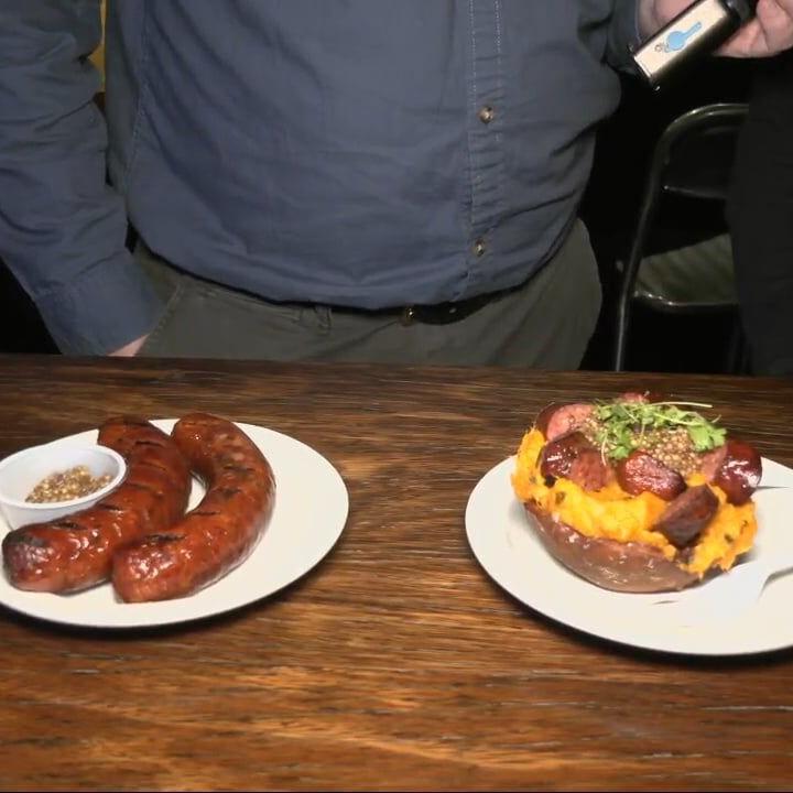 Keith Kaiser fills his belly with some bratwursts for the Bock and Wurst Fest